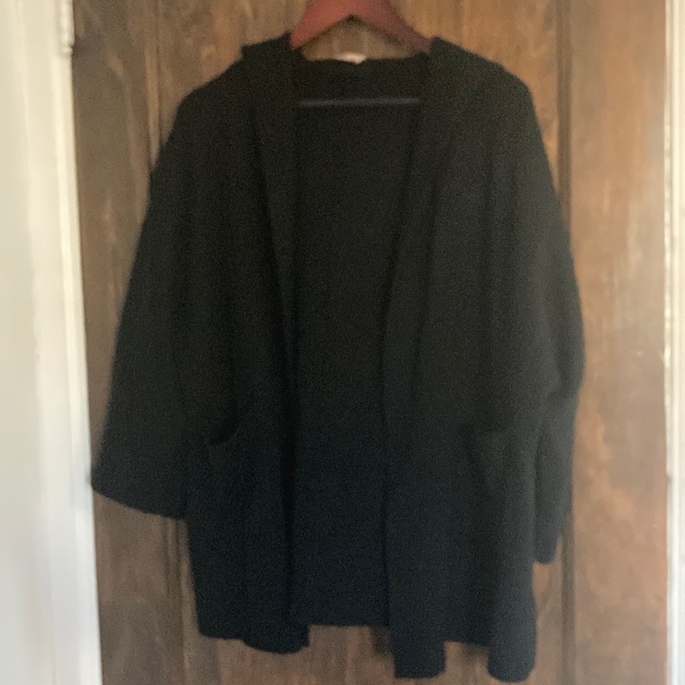 Gorgeous sweater with hood and front pockets!  Never worn. One size.